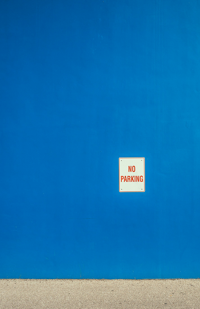 A image of a concrete sphere, balanced between two other larger spheres